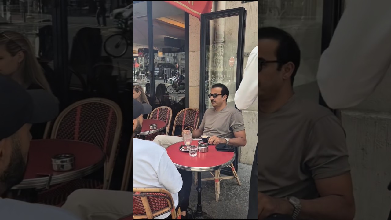 Sheikh Tamim bin Hamad Al Thani enjoying coffee with his friend at a beautiful restaurant in France
