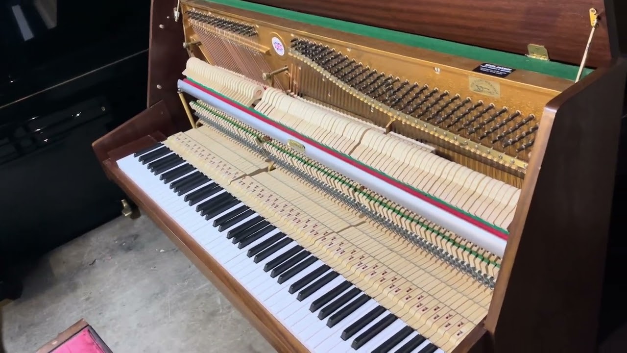 Spencer modern piano in a light mahogany case 