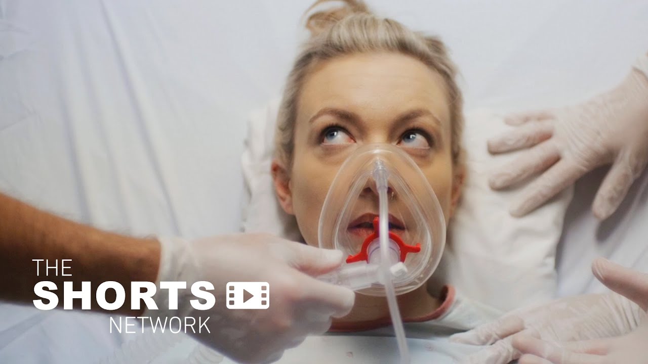 A Deaf woman undergoes a medical procedure to 