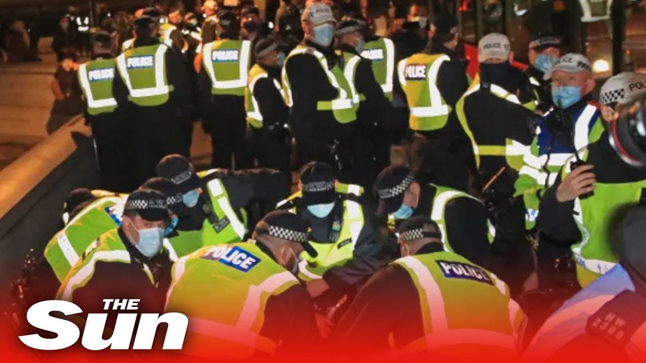 Police scuffle with London anti-lockdown & Million Mask March protesters