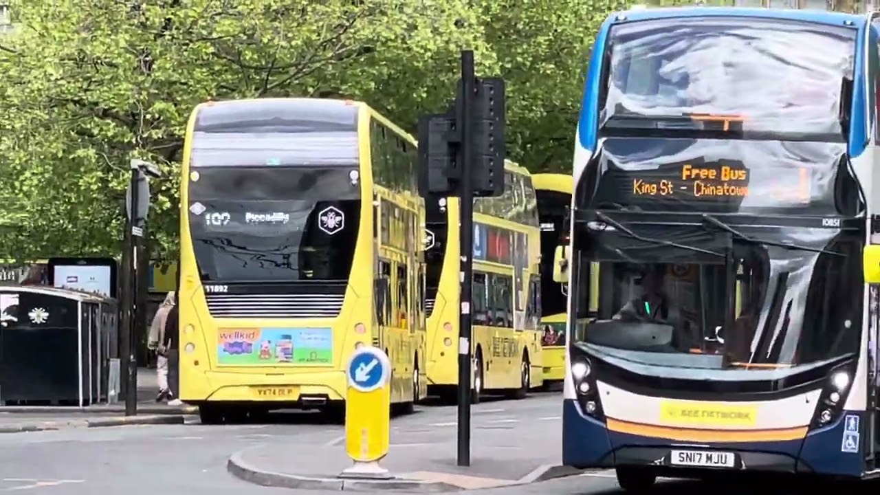 Buses and trams in operation in Manchester City centre May25.  Lots of yellow.