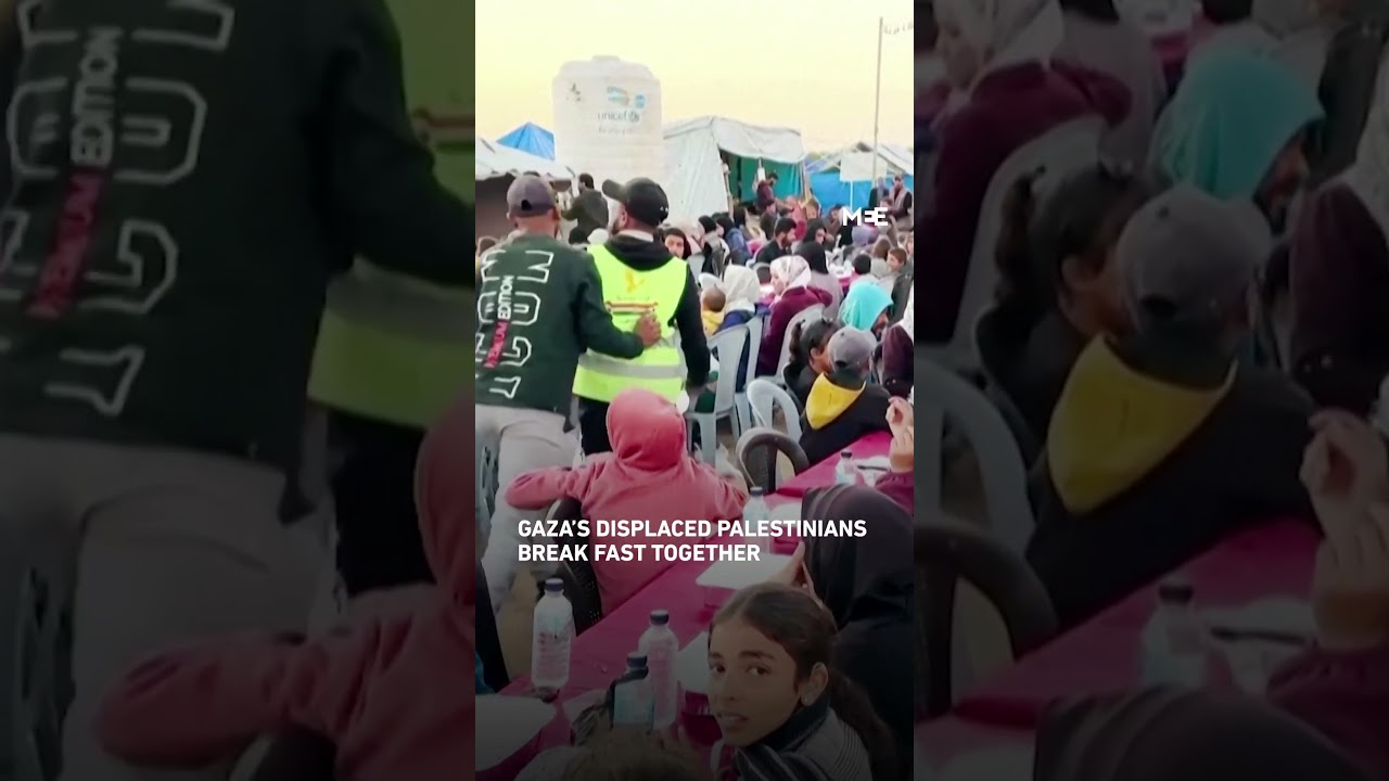 Palestinians break fast together in Gaza's displacement camps