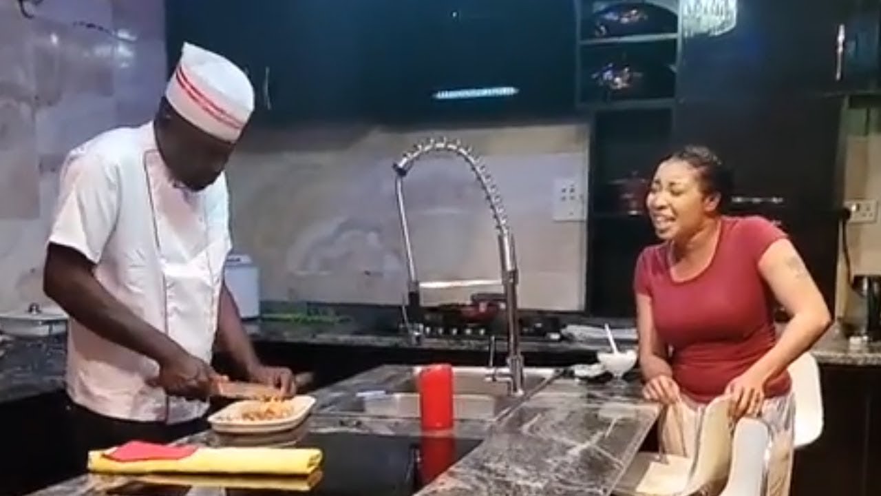 LIZZY ANJORIN AND HUSBAND HAVING A NICE TIME IN THE KITCHEN AS MR LAWAL PREPARE MEAL FOR THE FAMILY