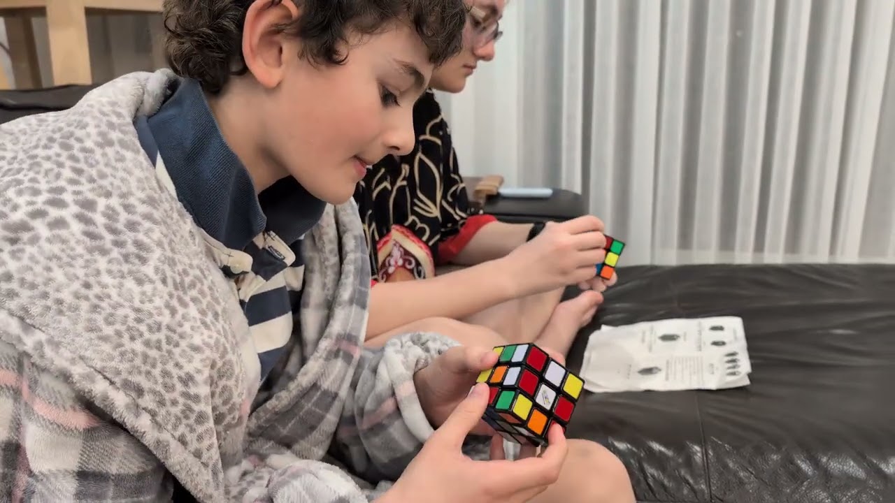 Arina and Adrian solving Rubik's