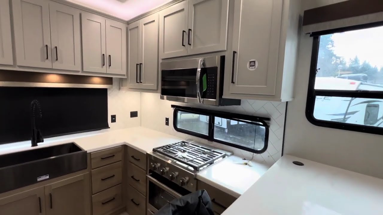 All new 2025 Forest River Sierra 395MMB Rear kitchen