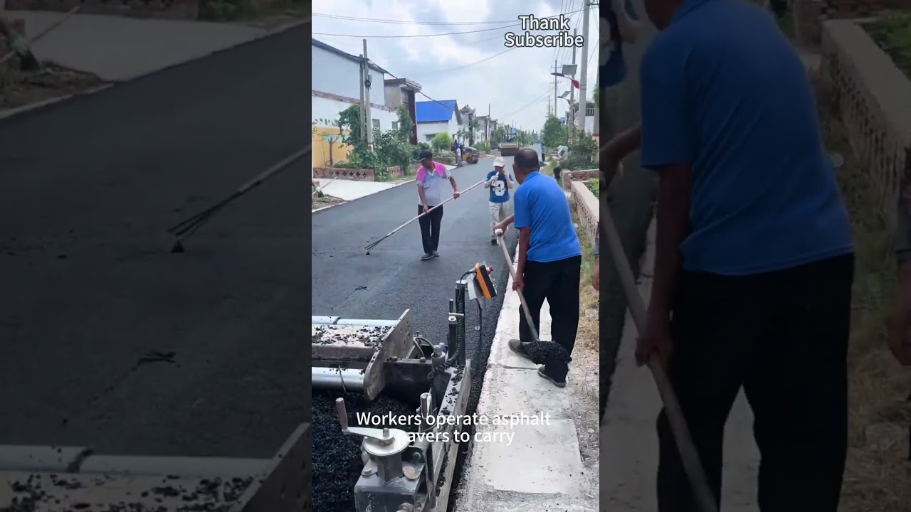 Pracownicy obsługują układarkę asfaltu, aby ułożyć asfaltową drogę