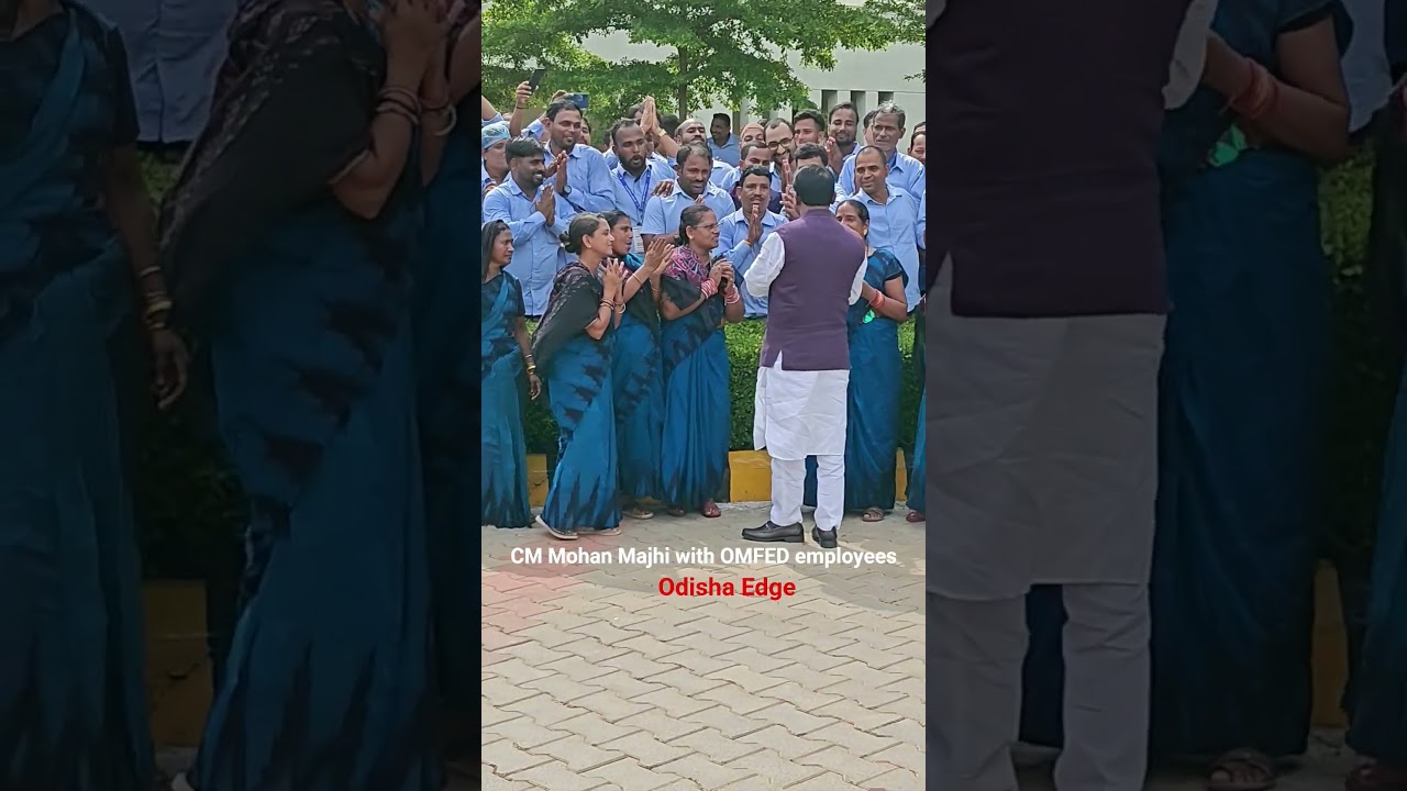Chief minister Mohan Majhi with OMFED employees during an event