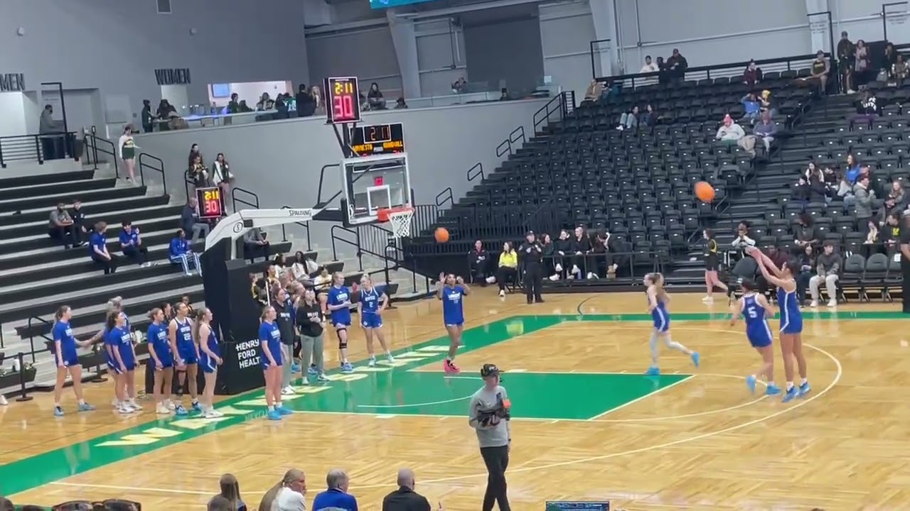 ￼ Grand valley Women’s basketball Warming up Showing the marching band ￼￼￼h