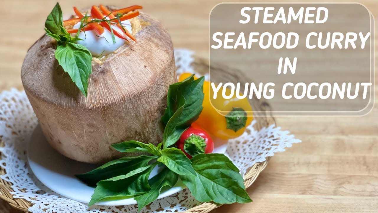 Seafood Curry Thai Style Steamed in Young Coconut