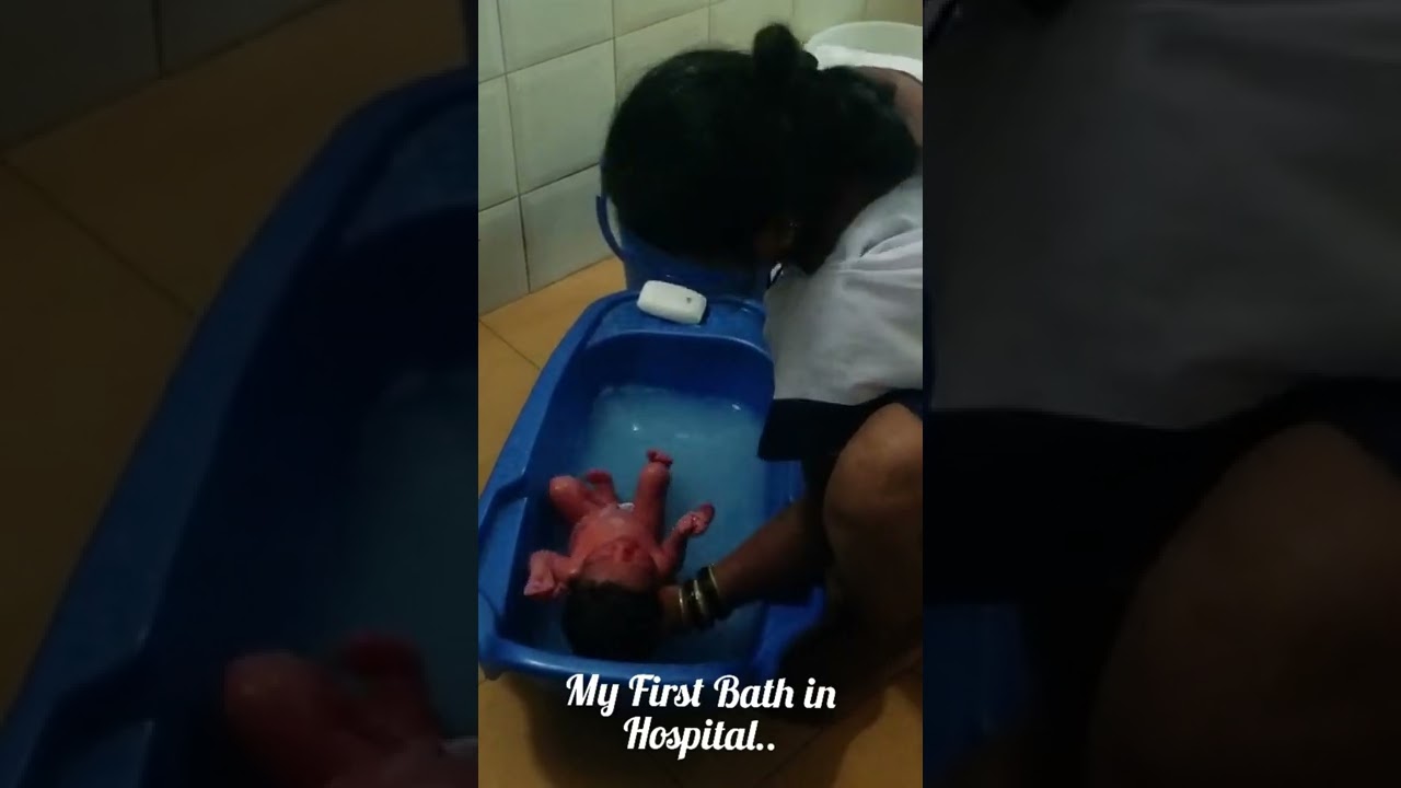 One Day old Little Fifi's initial bath at Hospital by his Expert Nanny....