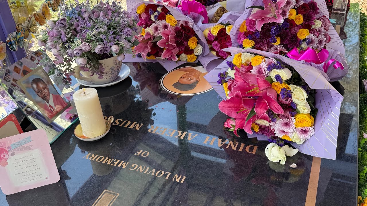 Visiting my daughter Dinah Akeer's resting place and laying flowers with family.