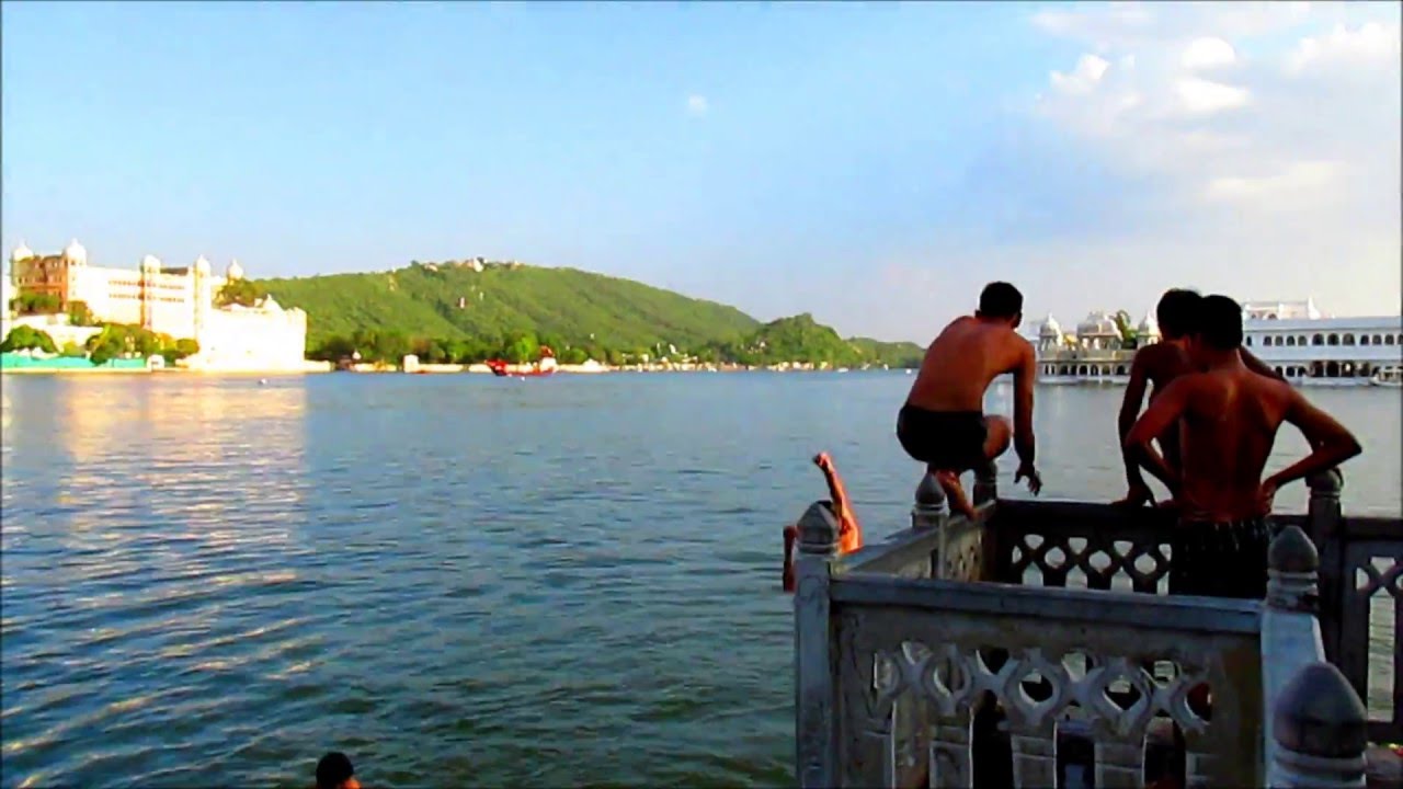 Boys bathing in the Pichola Lake, Udaipur. India.