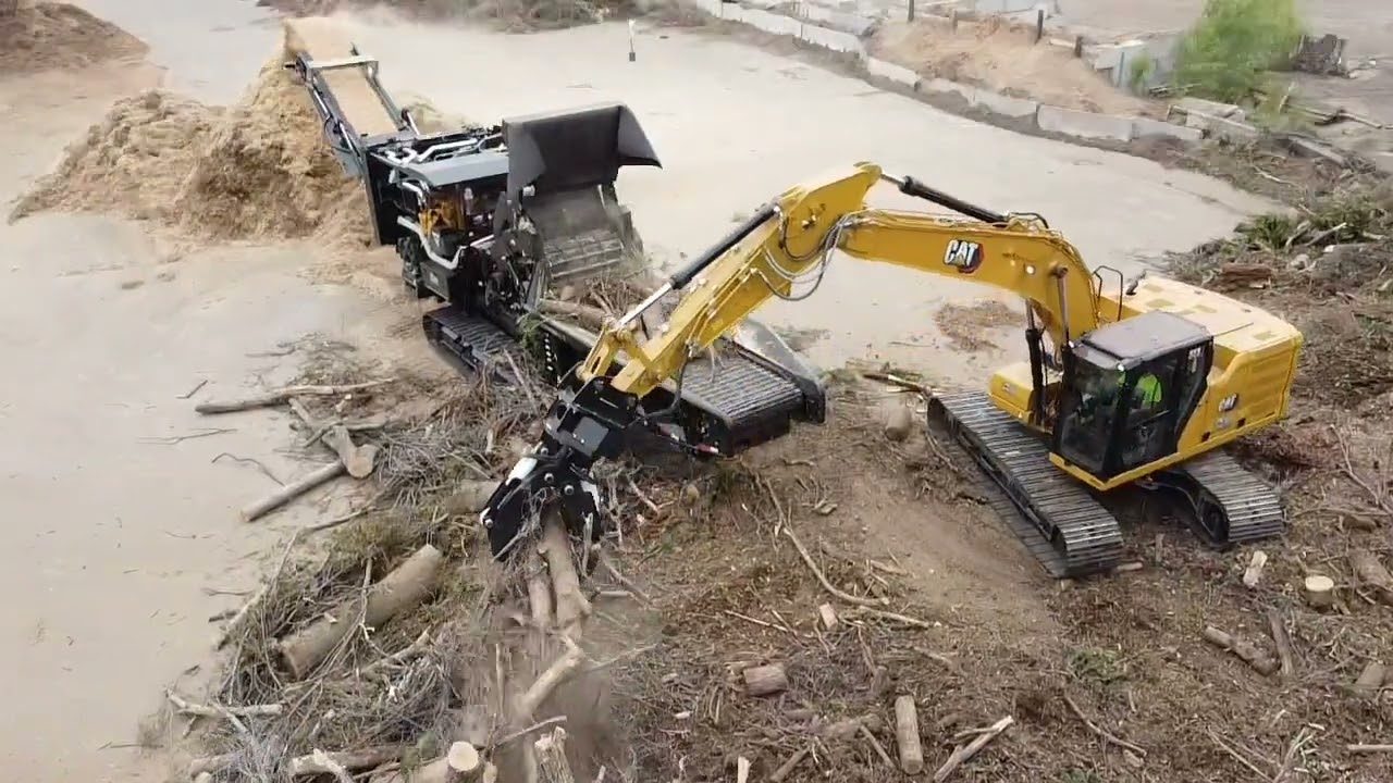 Vermeer HG6800TX Back in Black with the CMP 402B grapple slinging wood