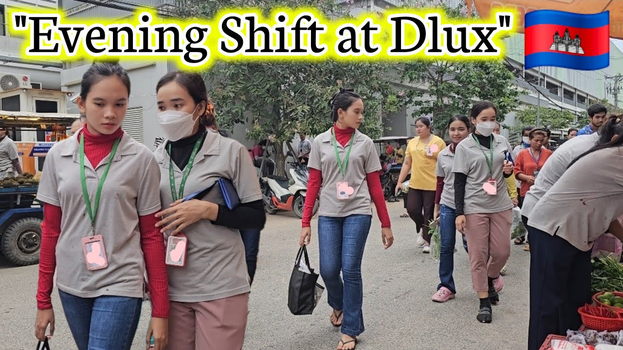 "Evening Shift Out: Dlux Factory Workers Heading Home"