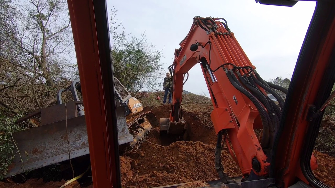 Case 850 Stuck.  Can the Kubota KX080 move it?
