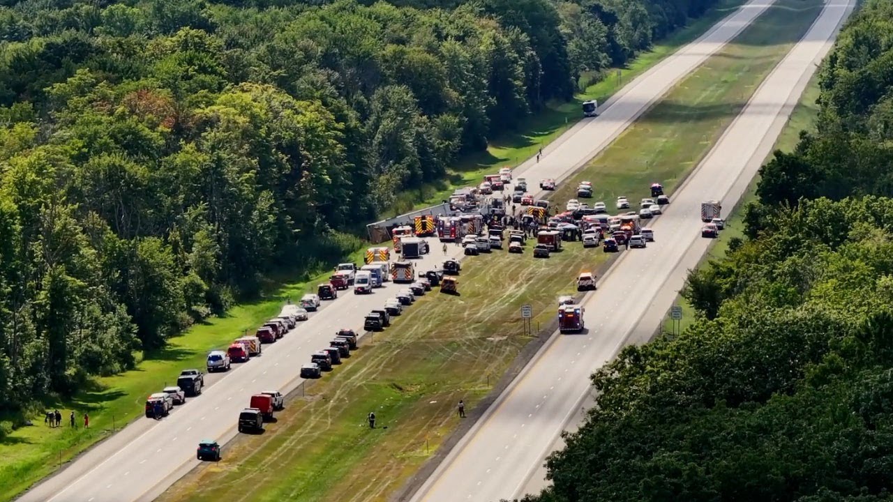 Drone video shows large emergency response to tour bus crash