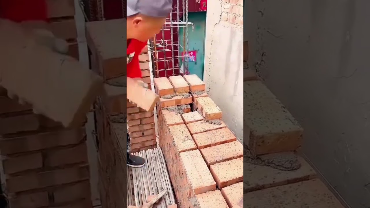 the process of installing red bricks for building a house 