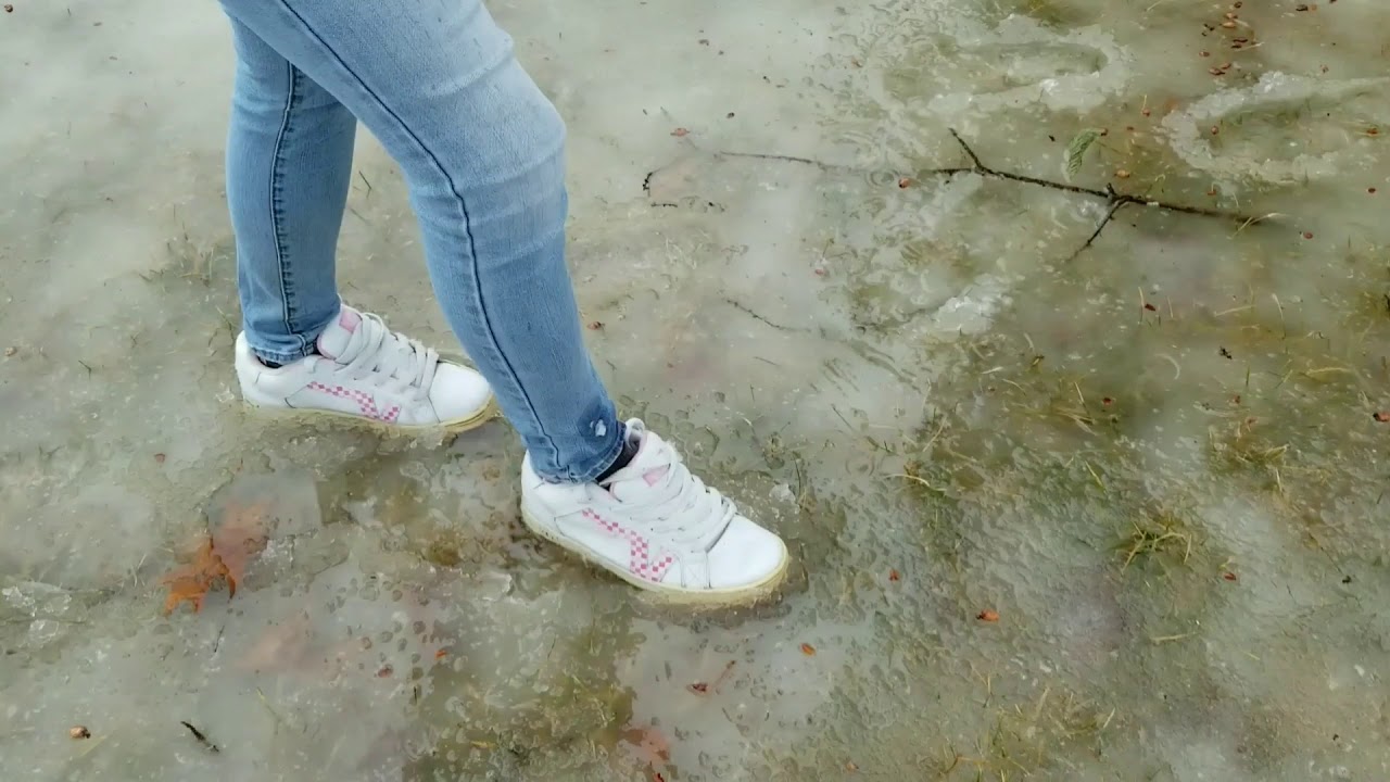 Girl walking in slush with white Vans! How long before they get wet XD