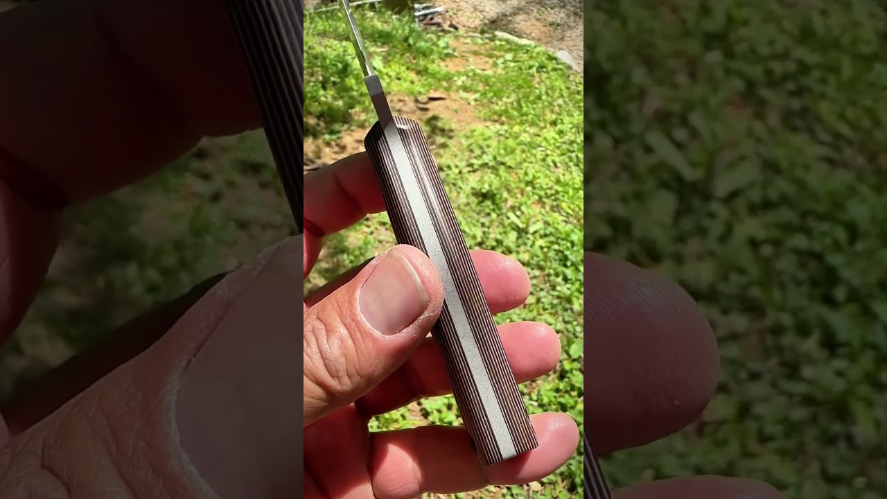 Richlite paper micarta and stainless NitroV steel.