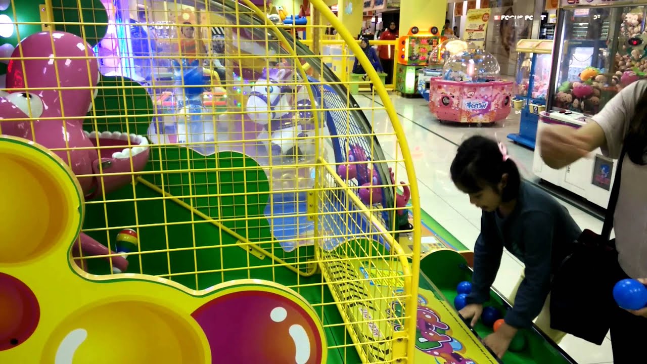 Rania playing Dino Pop game at Mid Valley