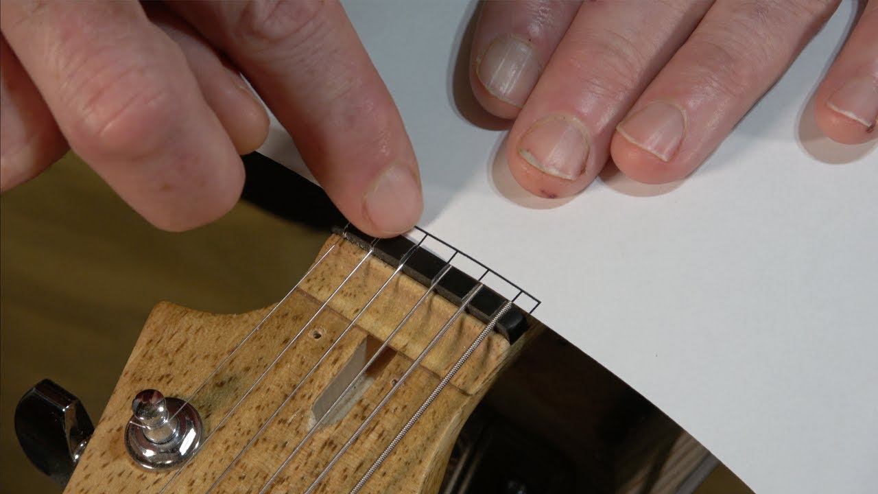 How Do You Determine String Spacing On A Guitar?