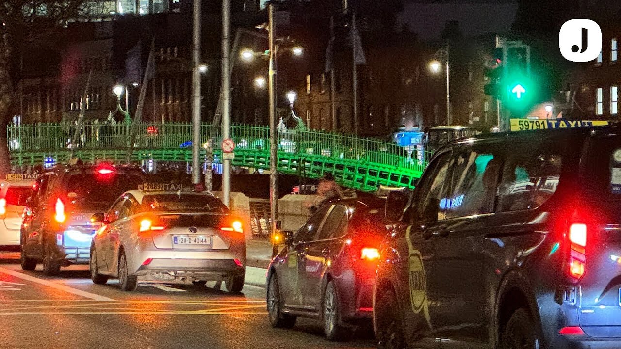 Taxi drivers in Dublin stage protest against Uber's new fixed rates