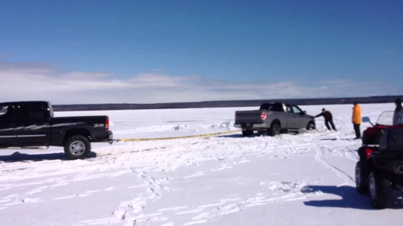 Brand new ford f-150 truck falls thru the ice on lake whoulsly