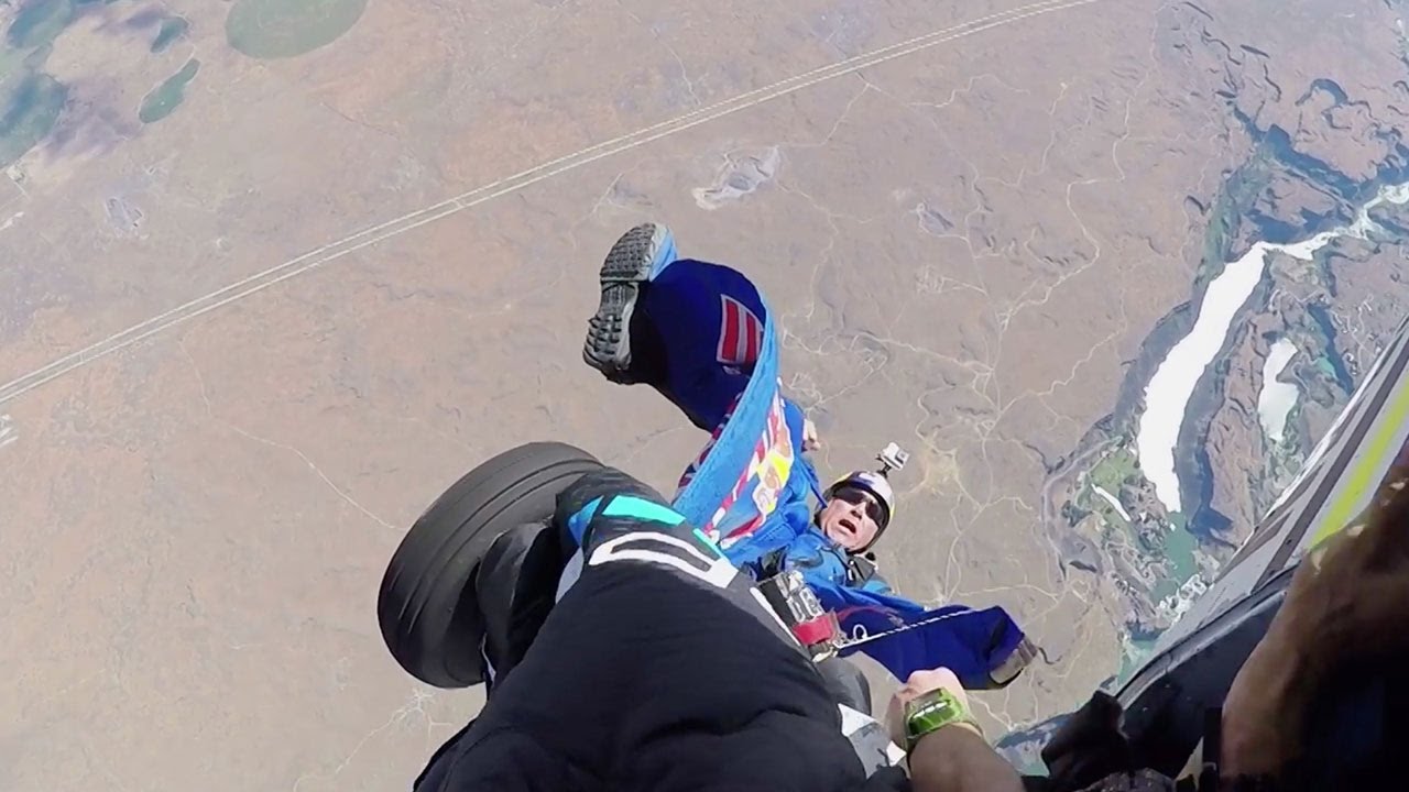 Miles Above Extra: Close Call as Wingsuit Gets Caught on Plane