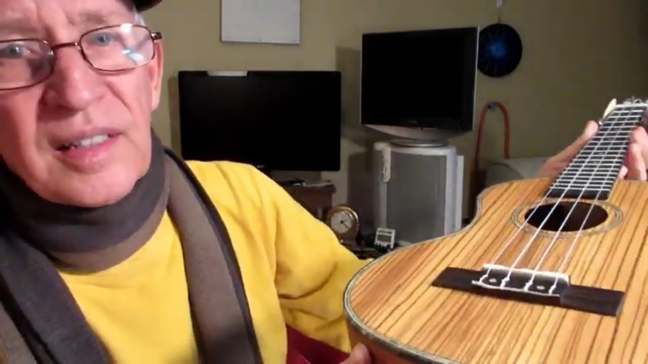 Unboxing Kmise tenor travel ukulele.  Thin body zebrawood.