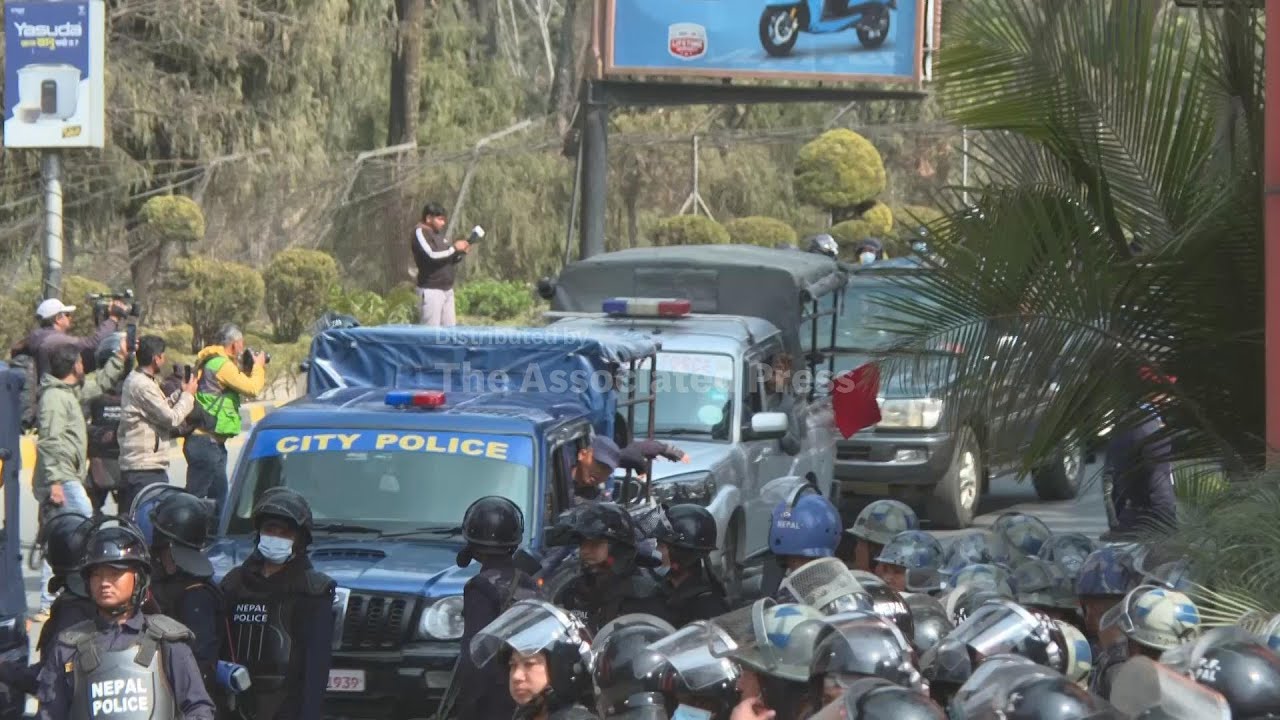 Supporters greet Nepal's former king Gyanendra Shah at Kathmandu airport