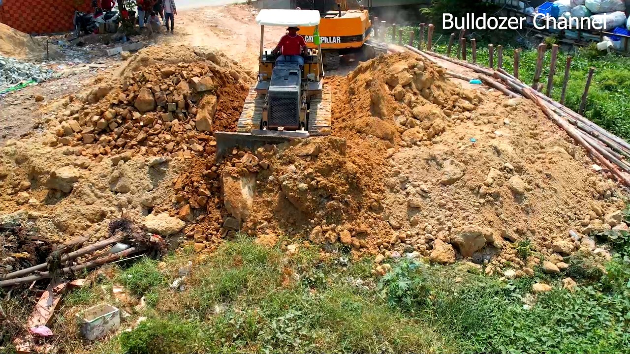 Transaction Filling up land By Dozer MITSUBISHI D20P Pusher Soil And Dump Truck Unloading Soil