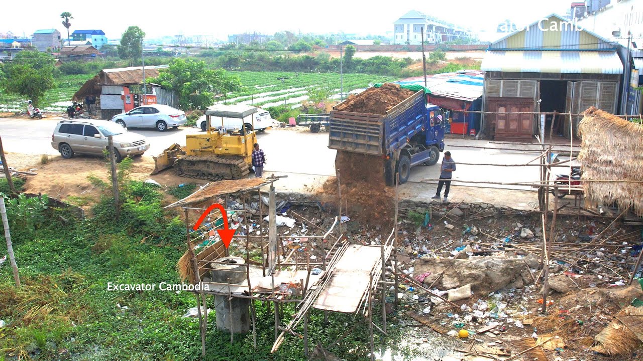 New Project Dozer D31P KUMATSU & Truck 5Ton pushing soil to remove pond To create a warehouse