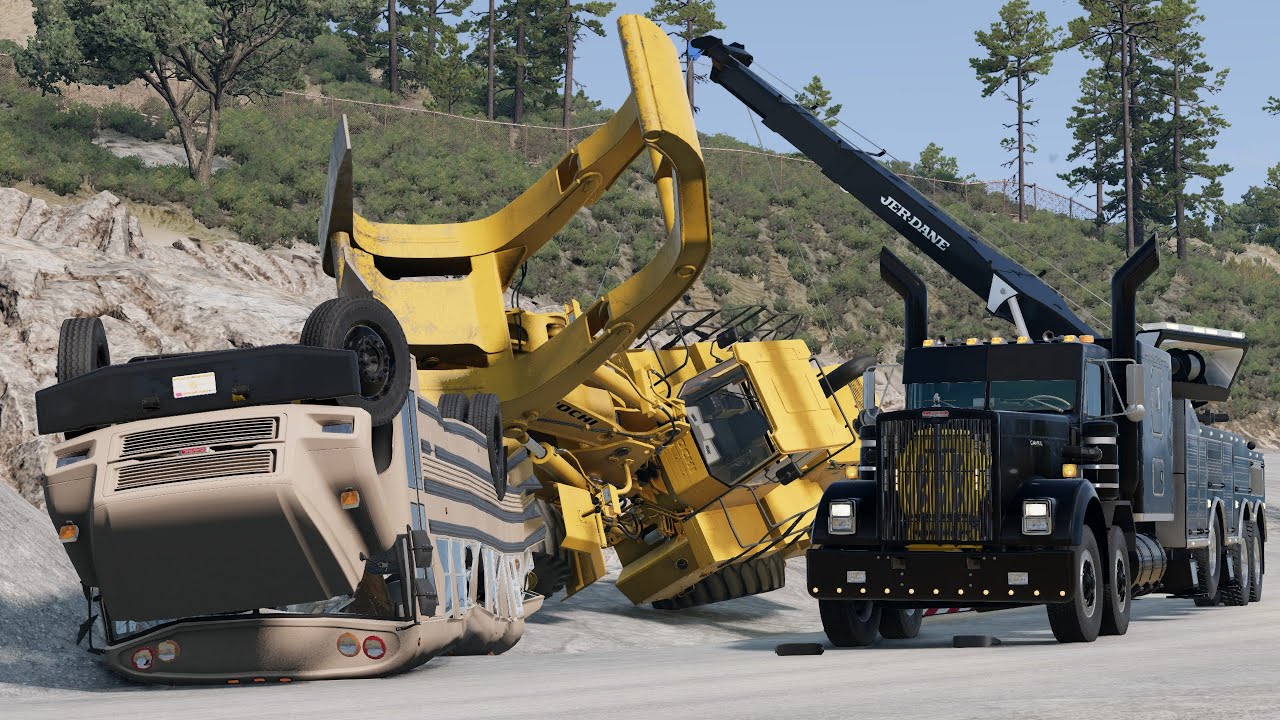 Epic tri-axle rotator recovers a heavy wheel loader and bus!