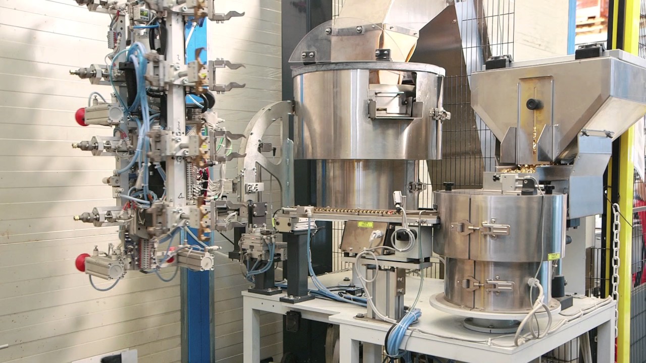 Water filters insert loading / overmolding station