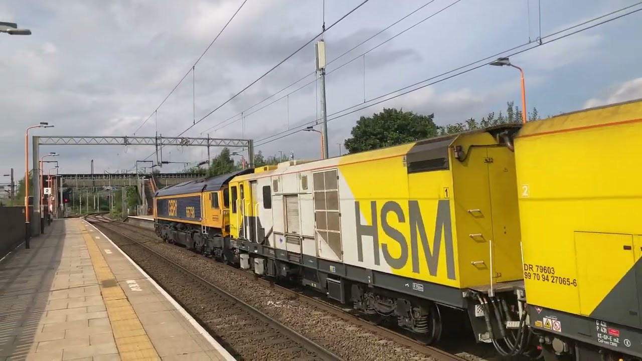 2 X Class 66 hauling maintenance train across Bescot Stadium Railway Station at 8/9/2022