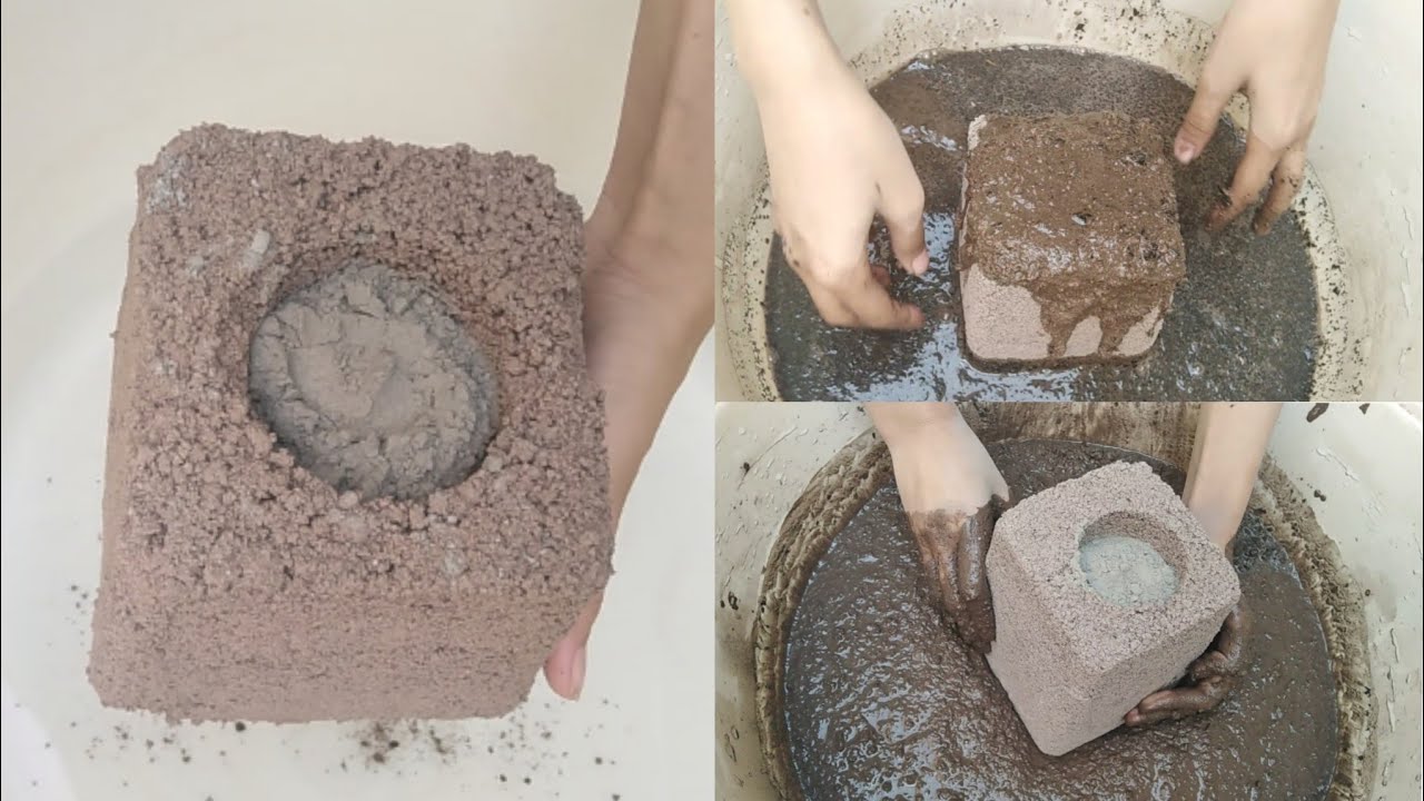 Soft mixed texture(gritty) buckets filled with cement crumbles and dipping in water