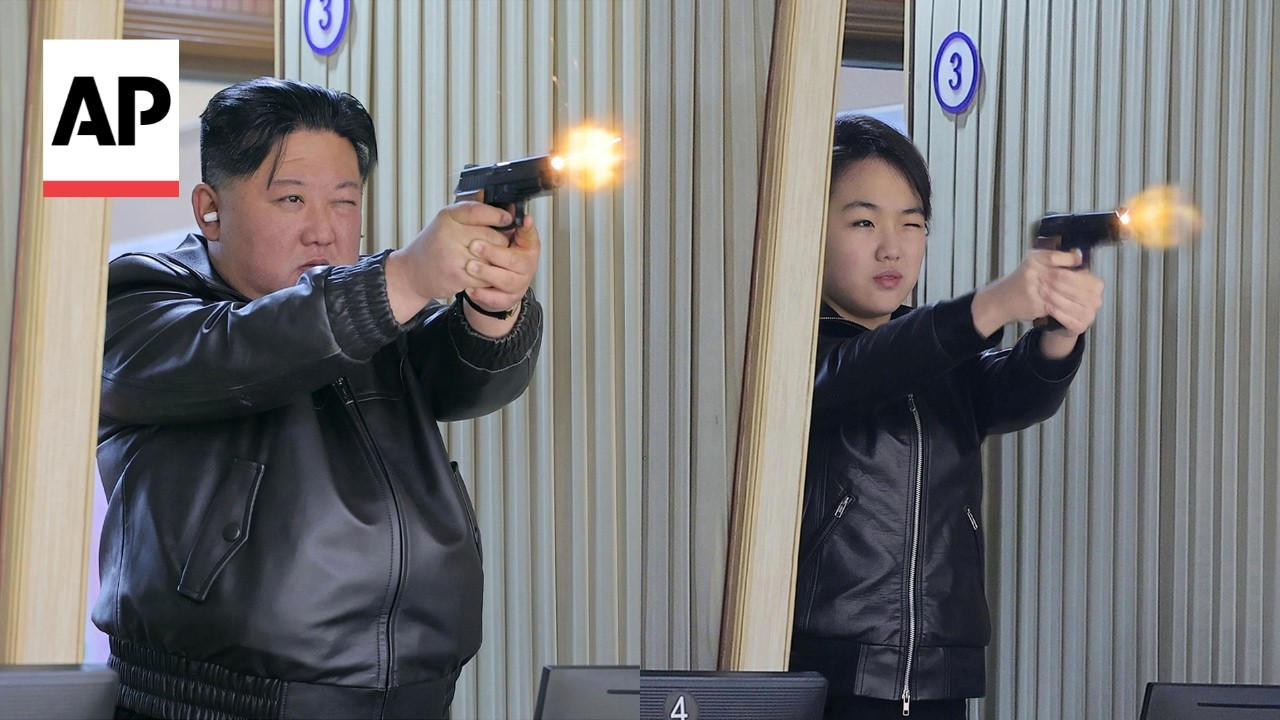 Kim Jong Un and his daughter shoot guns at North Korea weapons factory