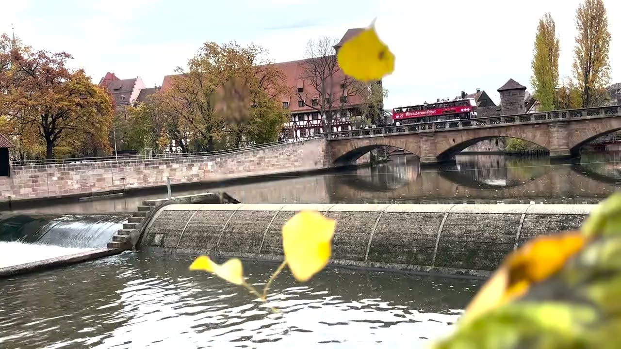 Red bus passing over, Relaxing Ambiance: Maxbrücke Old Town Nürnberg in relaxing Autumn view