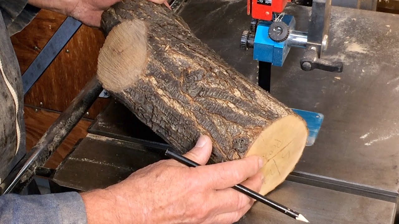 Richard Raffan cutting a pear branch into woodturning blanks