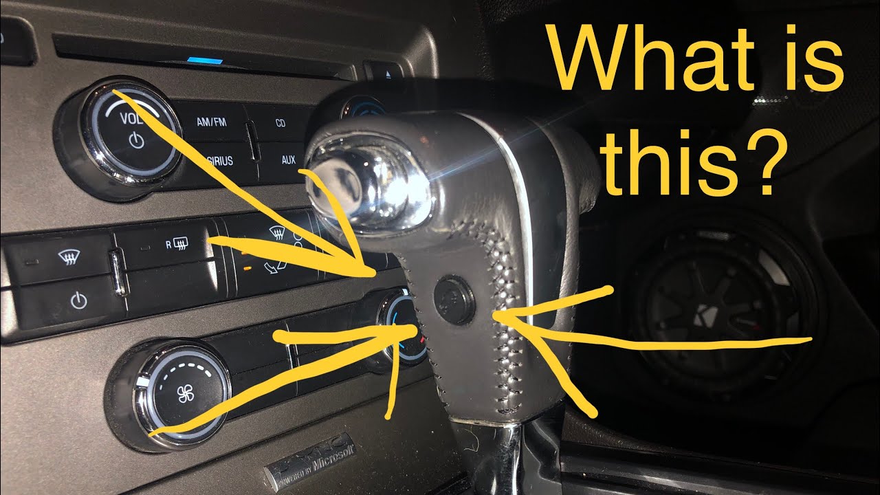 What does this button do? Side of gear selector