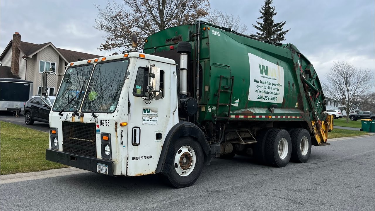 Roaring Waste Management Mack LE McNeilus Rear Loader Garbage Truck Packing Heavy Garbage