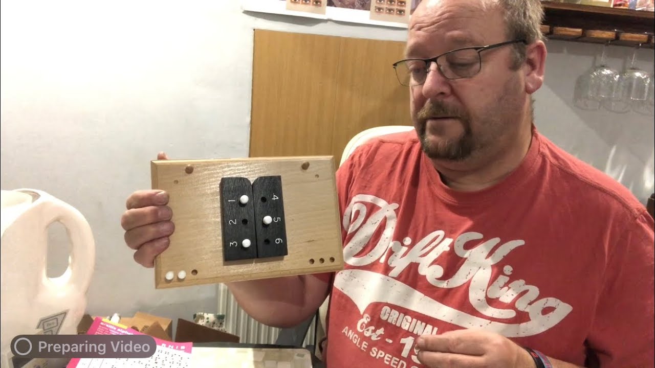 ASMR dispensing optician with low vision clinical aids and Braille box