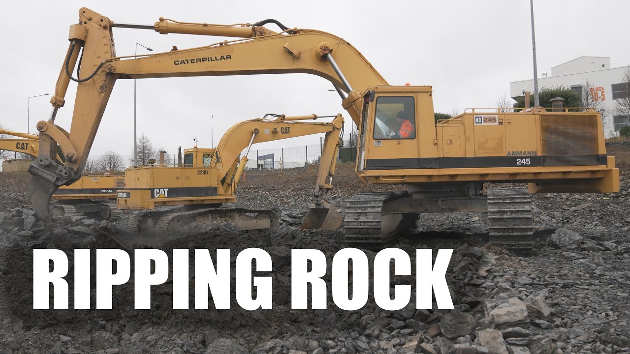 Cat 245 Ripping Rock