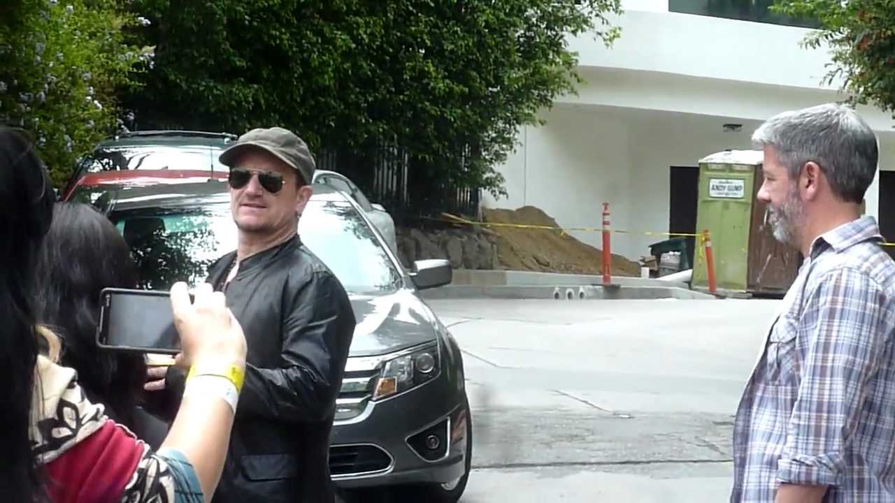 BONO of U2 Stops to sign autographs and take photos with fans