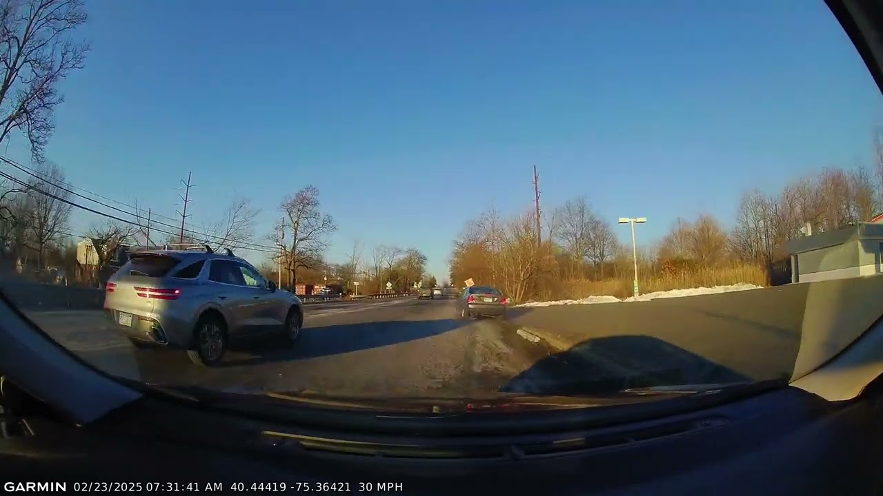 Car swerves to miss collision, hits massive pothole