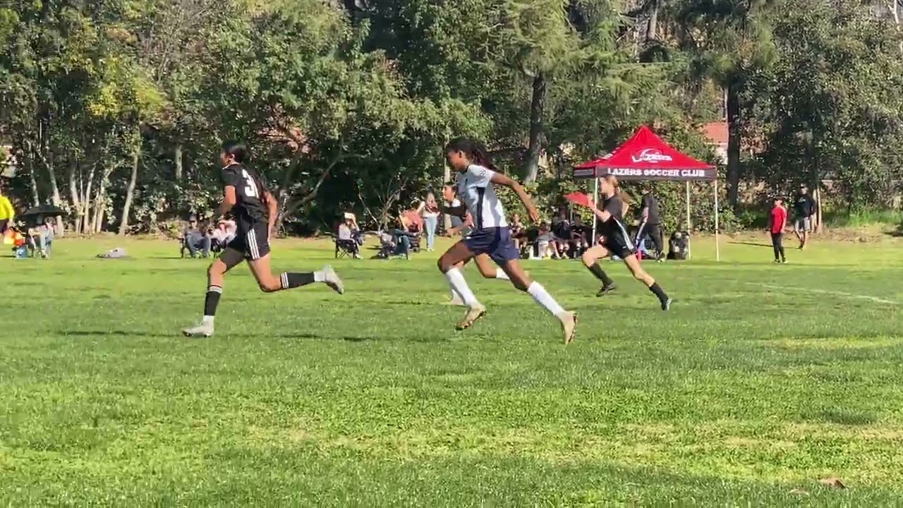 Emma #14 (white). United Central G12 vs Lazers FC. Feb 2026