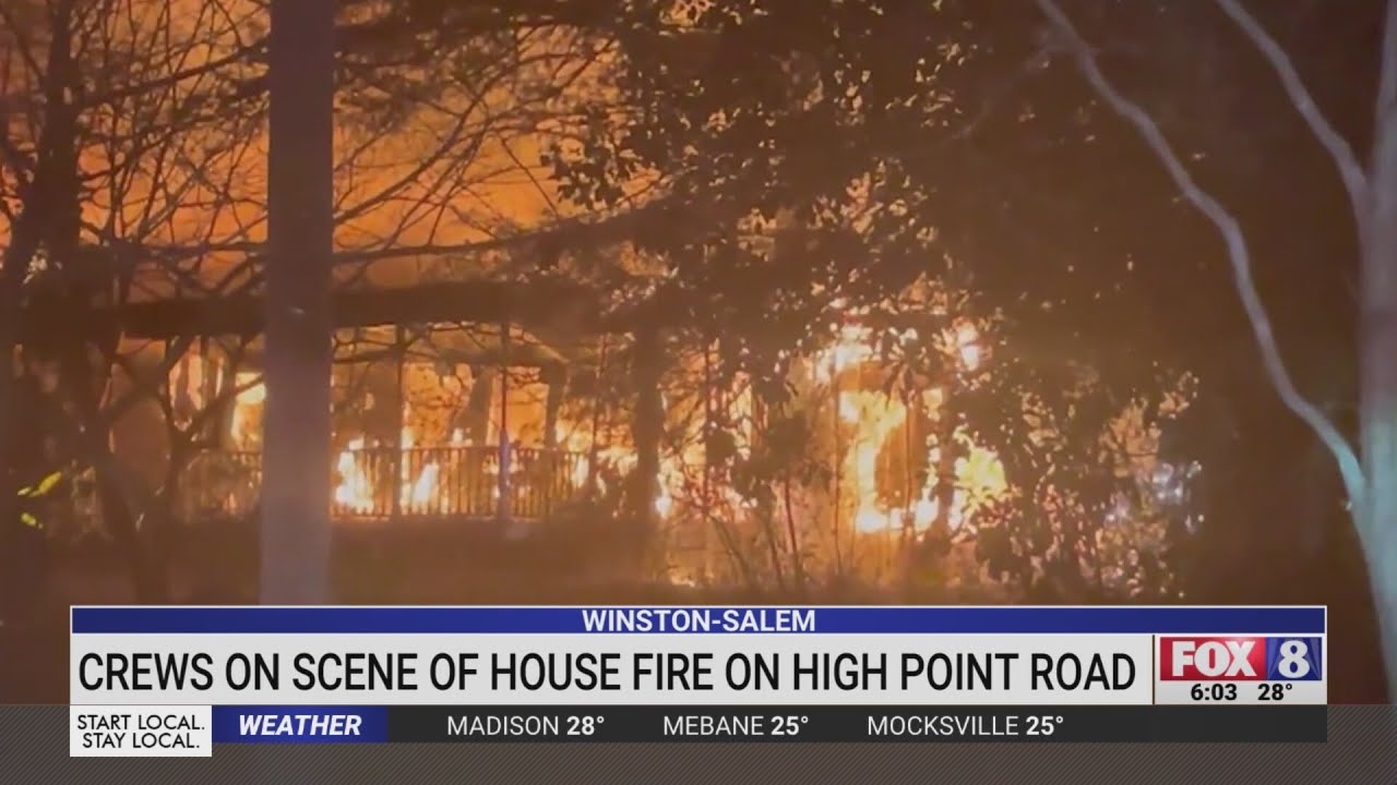 Crews battle house fire on High Point Road in Winston-Salem