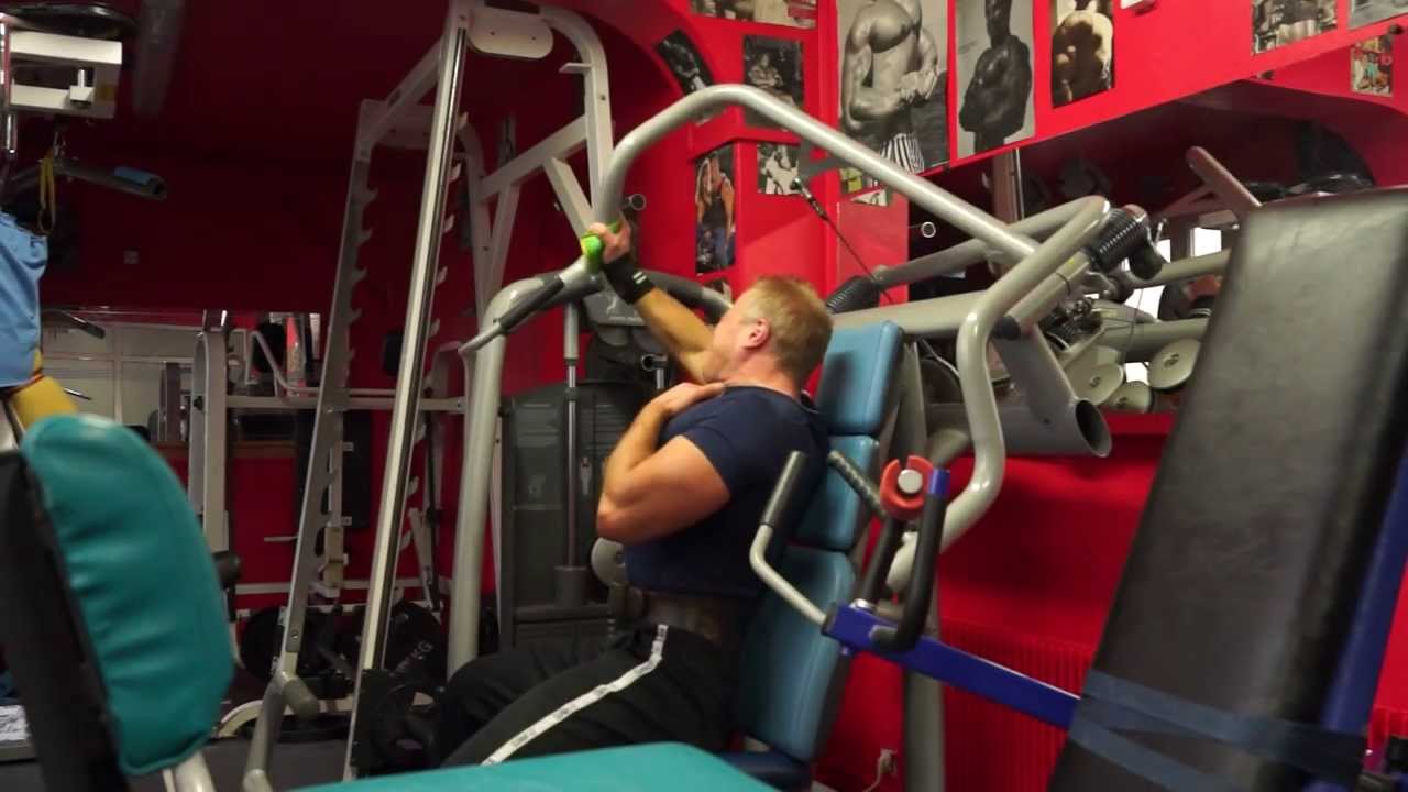 Michael Gundill performs upper chest supersets on a Technogym incline chest machine