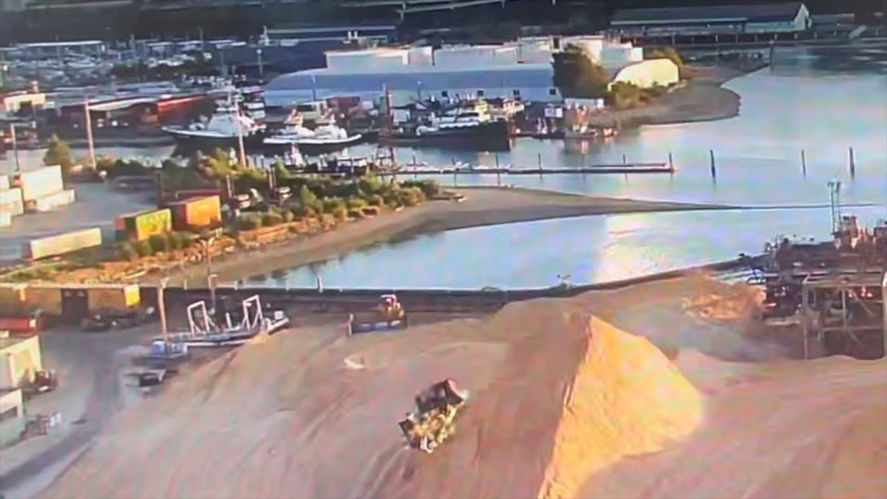 Bulldozer Rolls Over Off Sawdust Pile Port Of Tacoma