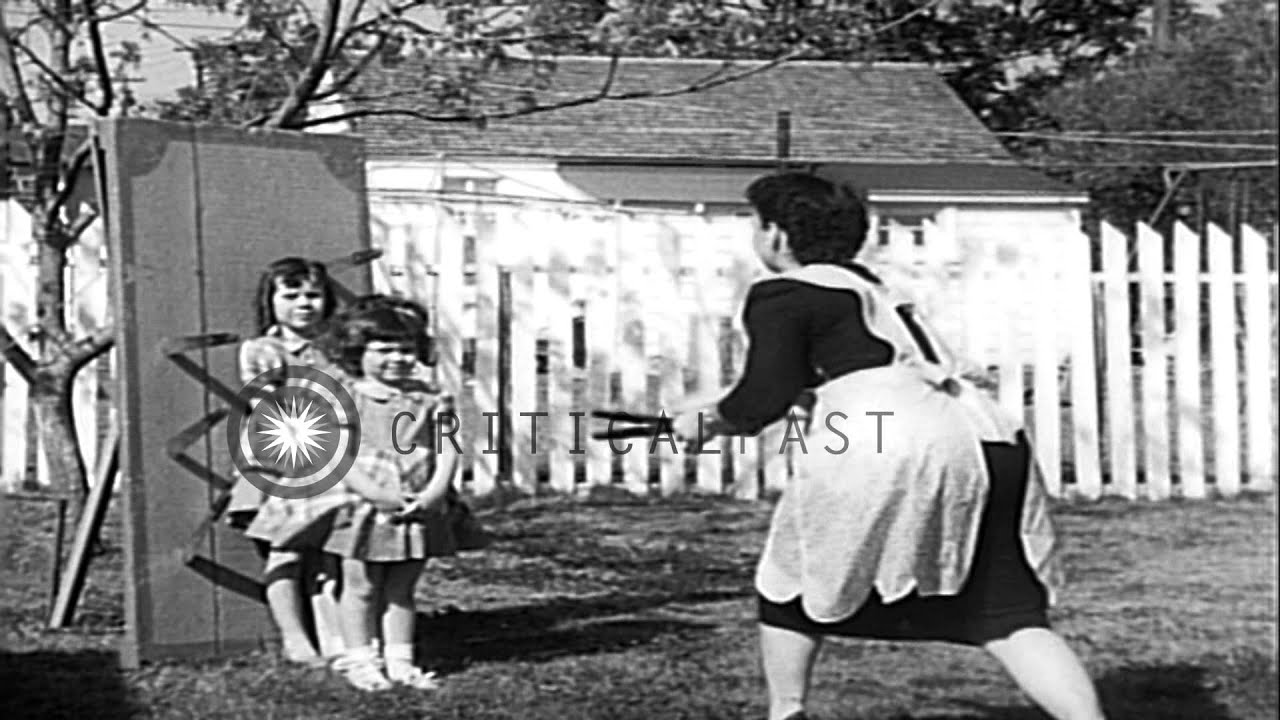 Knife-thrower Louella Gallagher with her three daughters in Austin, Texas HD Stock Footage